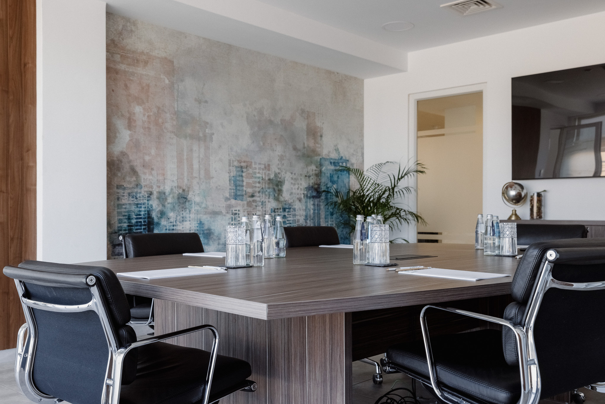 Boardroom with Eames chairs and artwork
